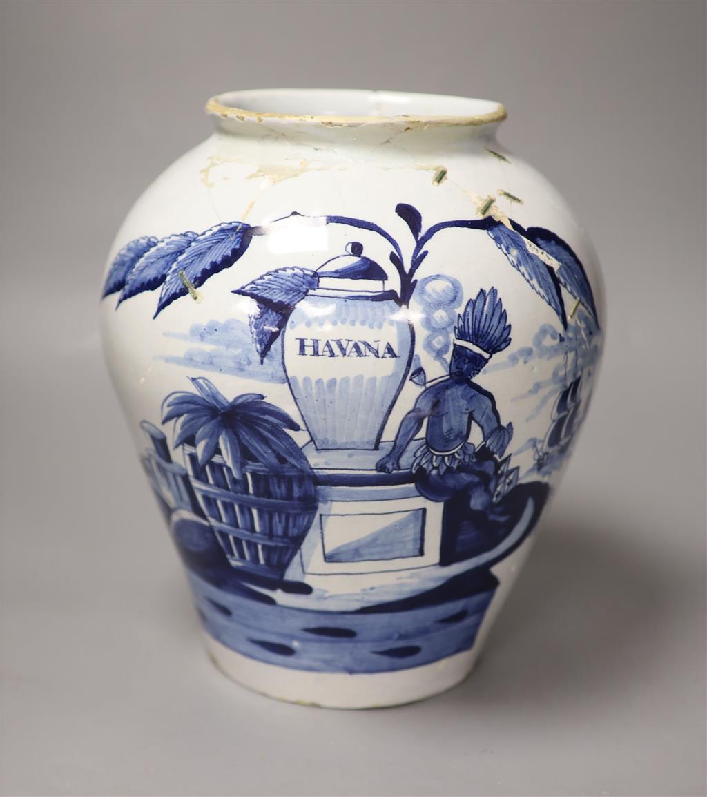 An 18th century Delft Havana tobacco jar, height 26cm (not including cover) (a.f.)